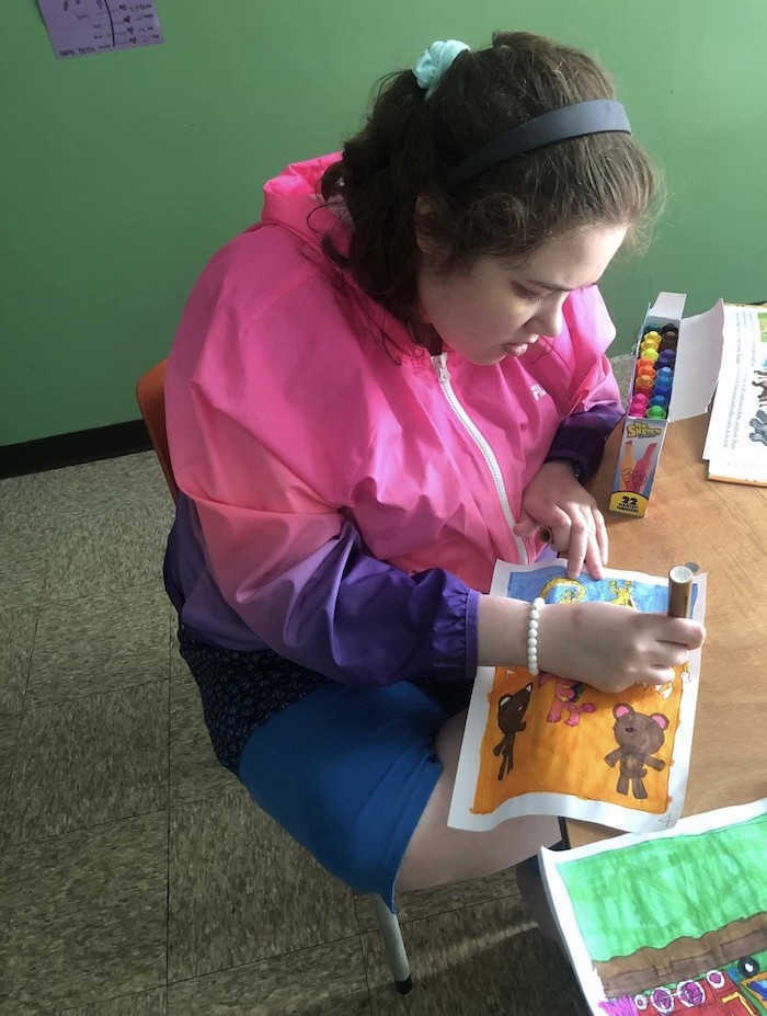 Molly drawing with markers