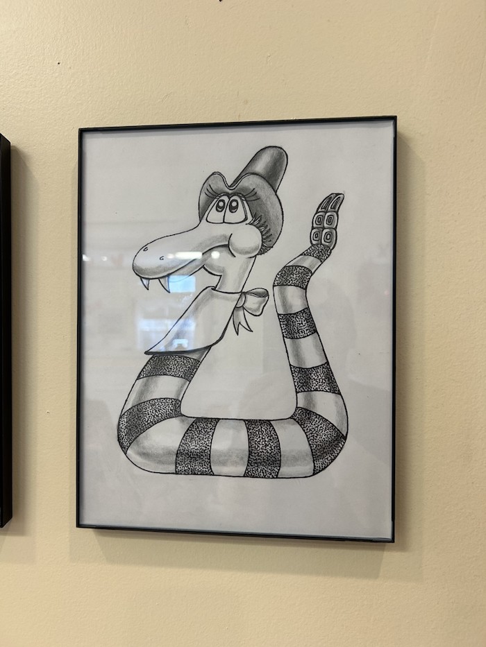 Drawing by Richard of a rattlesnake in a cowboy hat and bandana